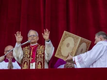 Pope Leo XIV greets the faithful in St. Peter's Square shortly after his election to the papacy, Thursday, May 8, 2025.