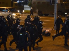Riot police detain protesters, who accuse strongman Alexander Lukashenko of falsifying the polls in the presidential election, in Minsk, Aug. 10, 2020. 