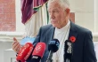 Cardinal John Dew speaking during a press conference in Wellington, New Zealand