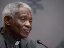 Cardinal Peter Turkson, chancellor of the Pontifical Academy of Sciences and the Pontifical Academy of Social Sciences, speaks at a press conference on “Risks and Opportunities of AI for Children: A Common Commitment for Safeguarding Children” on March 20, 2025, at the Vatican.
